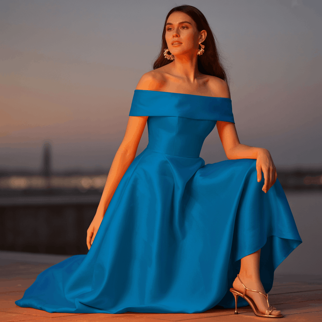 31 Cinco de Mayo Outfits Women Will Love (Because Life's Too Short to Wear Boring Colors) 31 Woman wearing a cobalt or fuchsia off-shoulder maxi dress with gold strappy heels and hoop earrings for a dramatic evening Cinco de Mayo outfit.